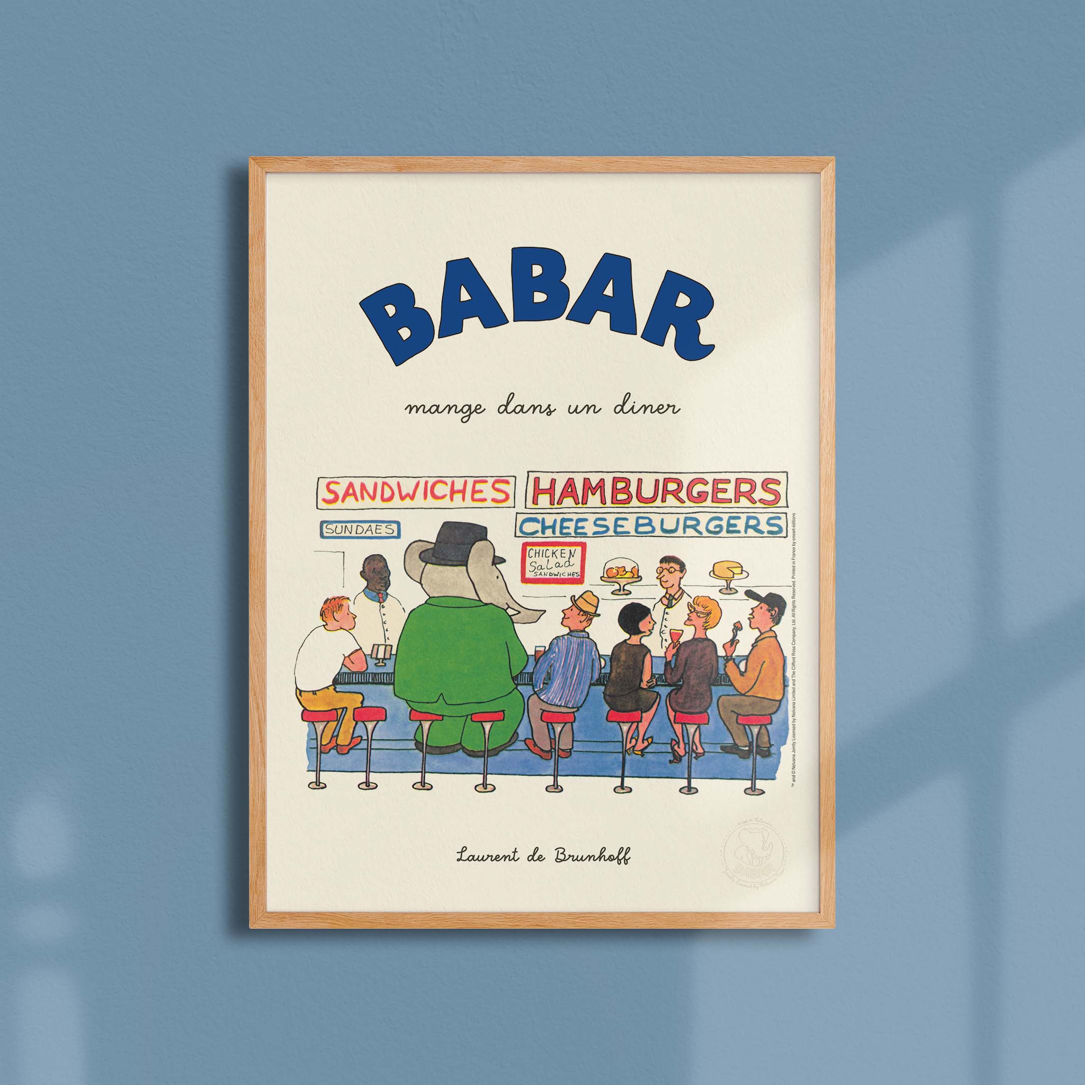 Affiche "Les Imparfaits" Babar mange dans un diner